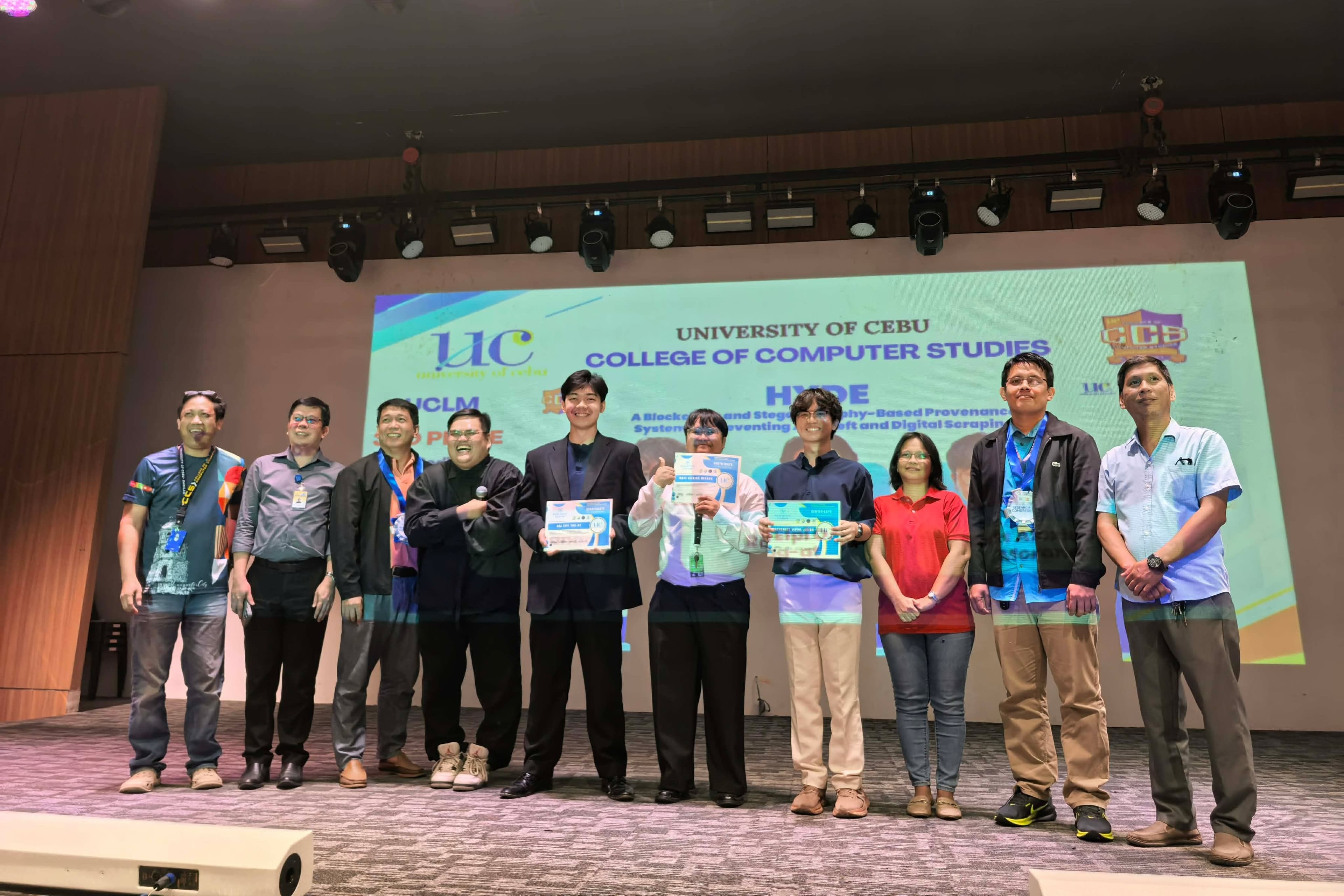 Research Congress awardees and faculty posing together onstage