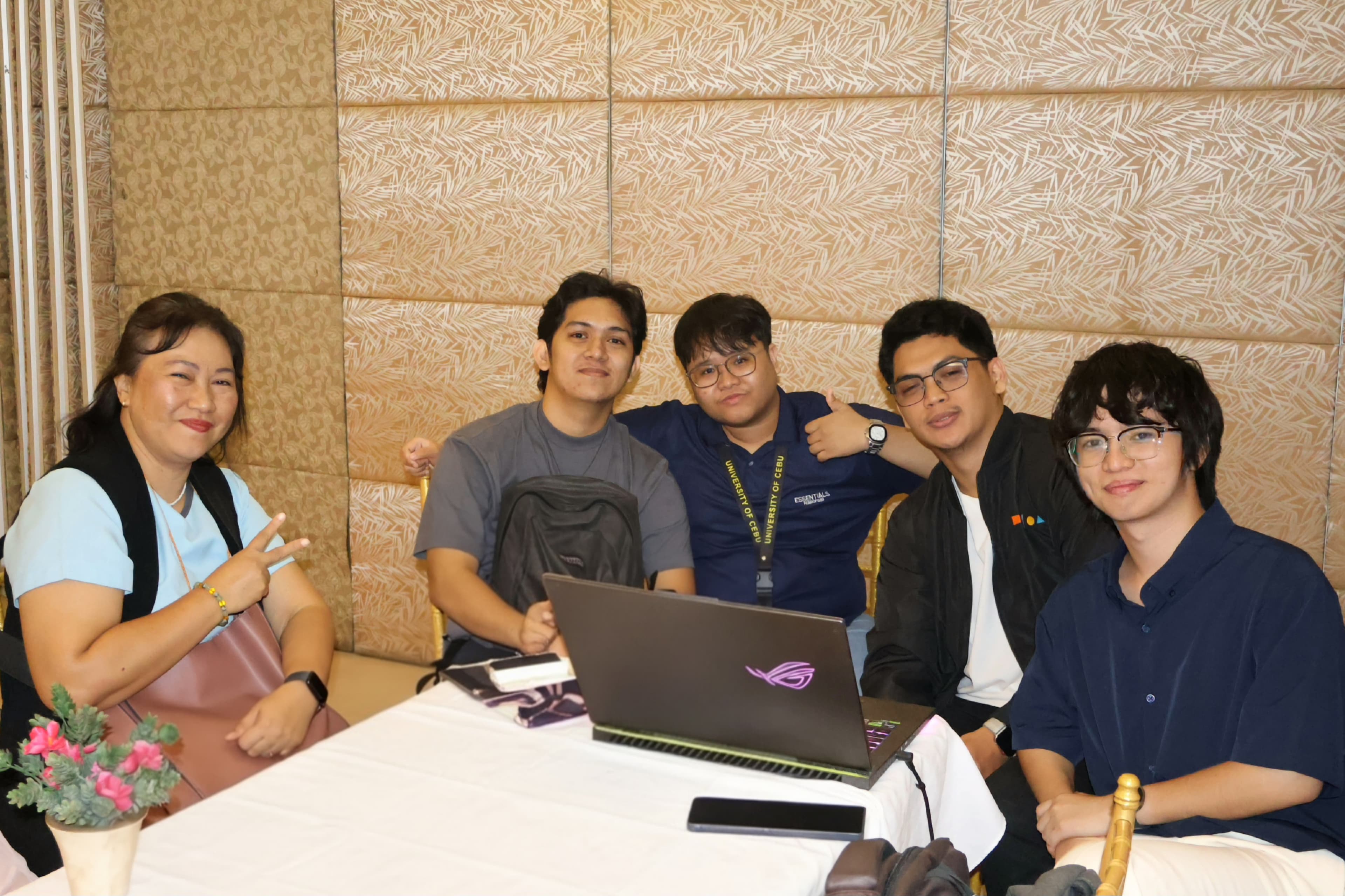 From Paper to Data team collaborating around a laptop during the logistics challenge