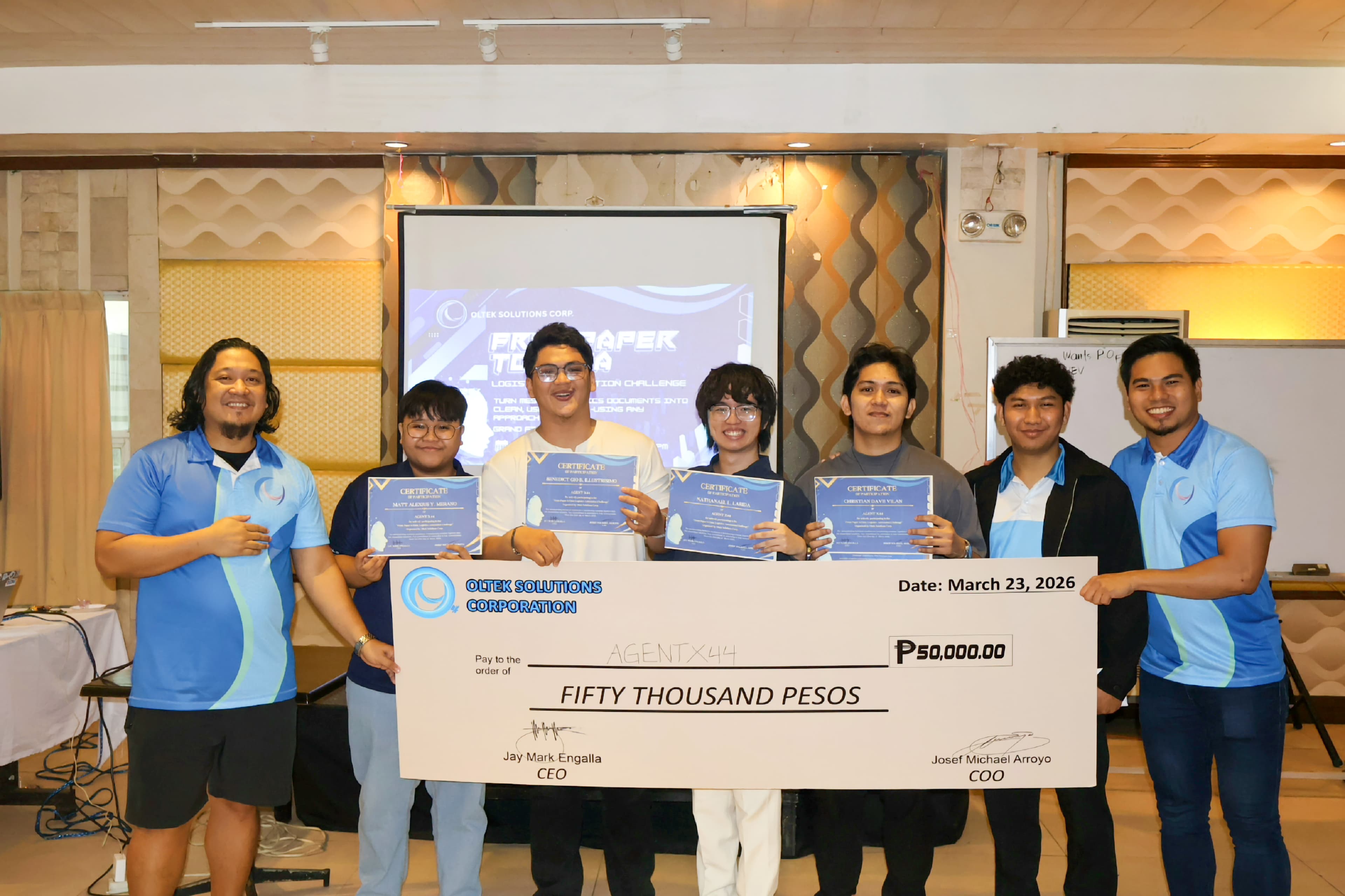 From Paper to Data champions holding certificates and a fifty-thousand-peso prize cheque